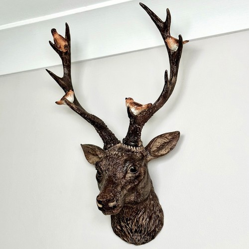 Brown stags head with red - brown,